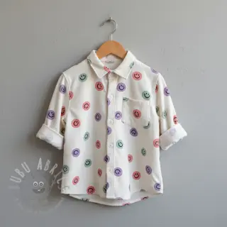 Bomullstyg FLANNEL Happy faces off white lilac