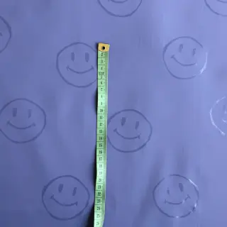 Látka na pršiplášť Happy faces purple